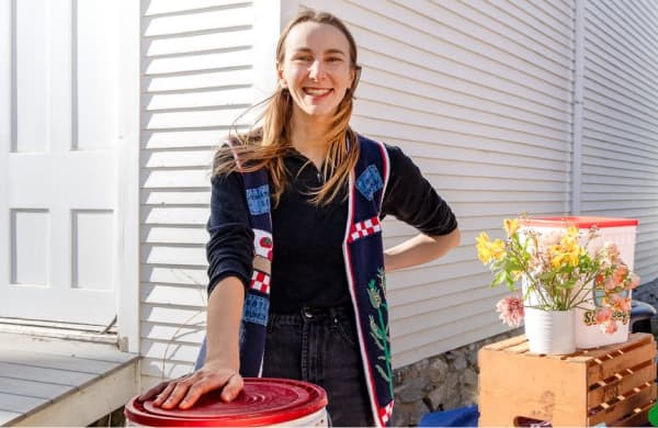 A woman at a compost information stall